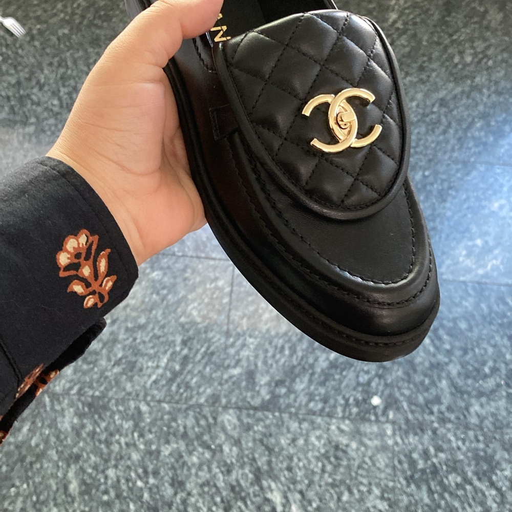 CHANEL Black Quilted Loafers with Gold Emblem